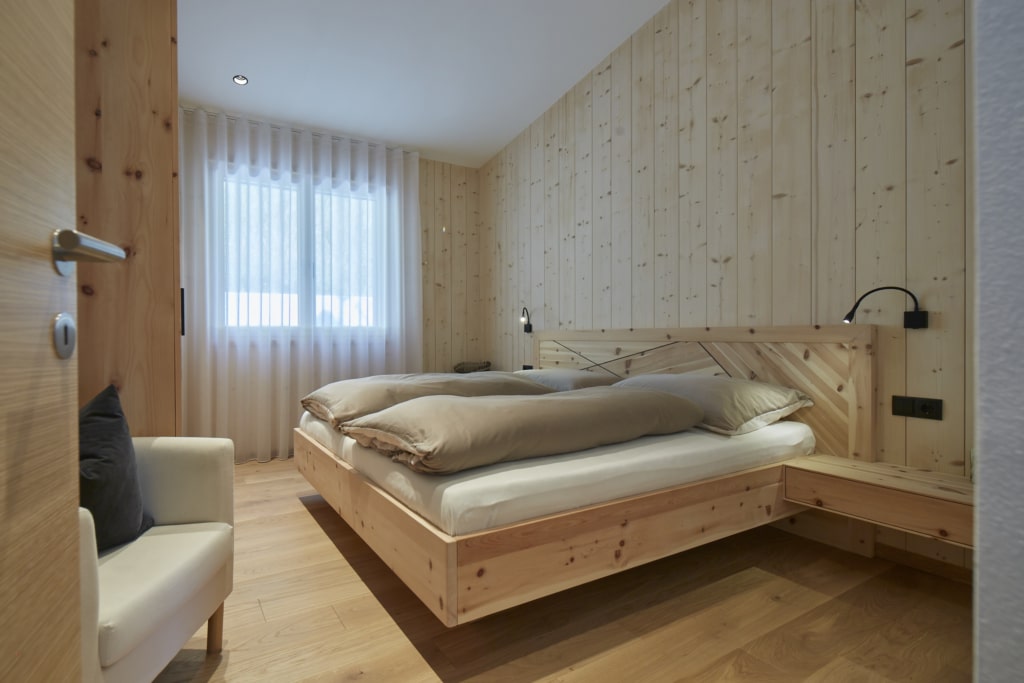 casa in legno massello di holzius camera da letto